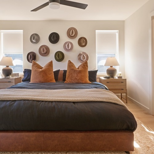 Relax in your spacious primary bedroom suite with balcony large king bed